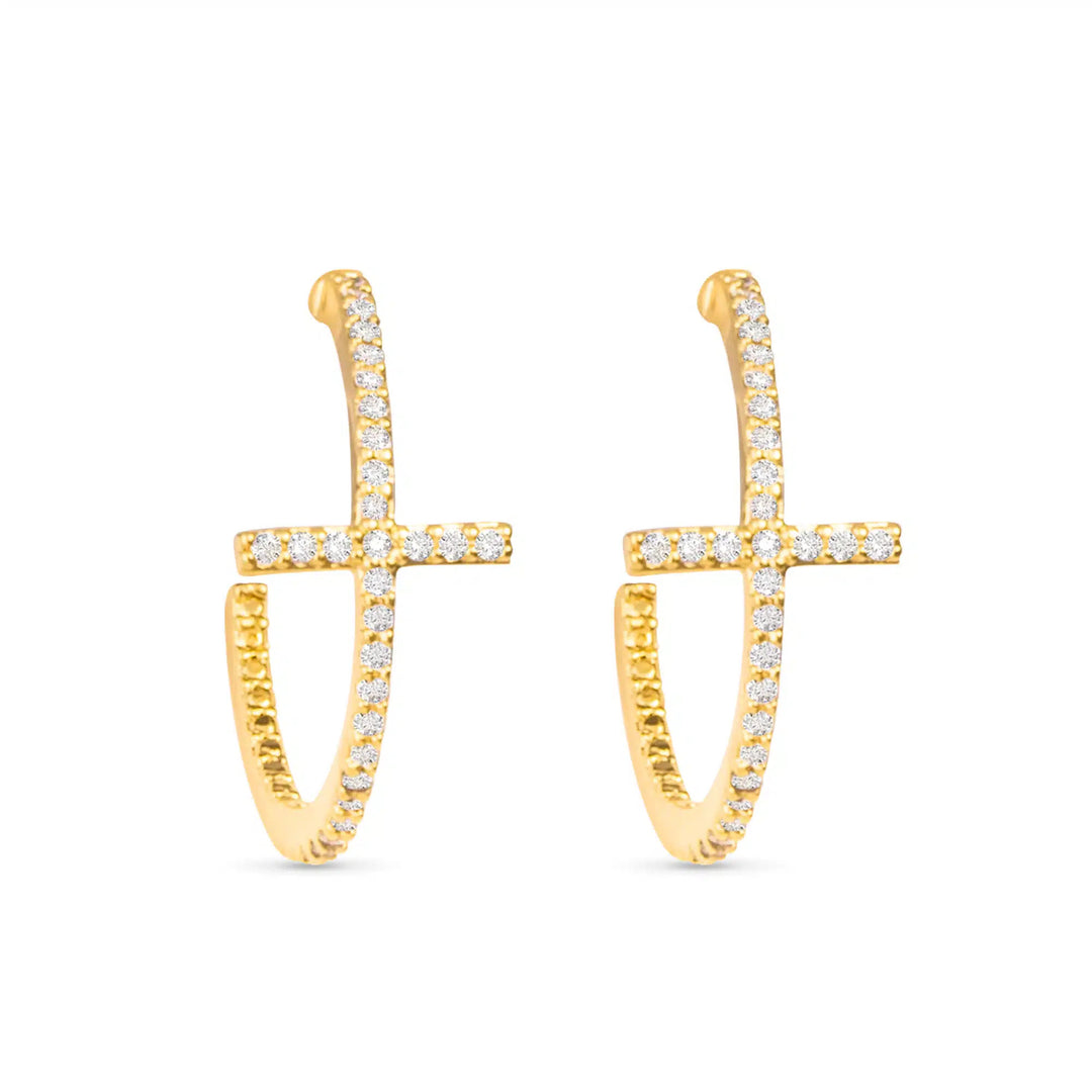 Gold hoop earrings featuring a vertical cross design accented with sparkling cubic zirconia.