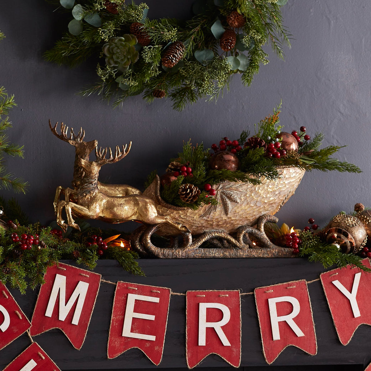 Polystone deer figurine with sleigh in natural tones