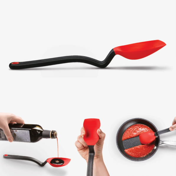 Red silicone Supoon spoon with weighted handle designed to stand upright off the counter.