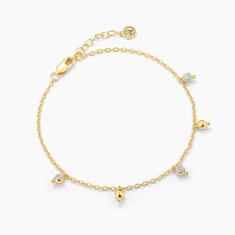 Silver chain bracelet with a shimmering teardrop diamond pendant featuring lobster clasp closure.