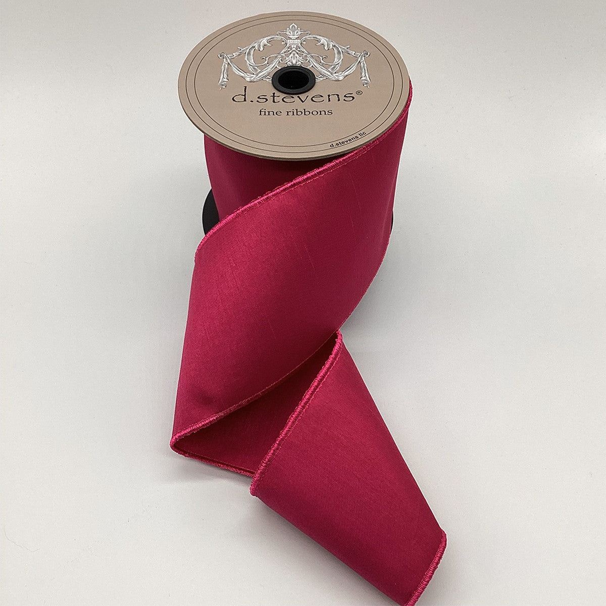 4 inch wide magenta Faux Dream Dupion ribbon on a spool with a textured, elegant sheen.