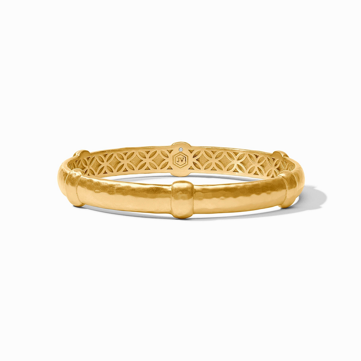 Sahara Bangle in 24K gold plate with a hammered texture and decorative interior lattice pattern.