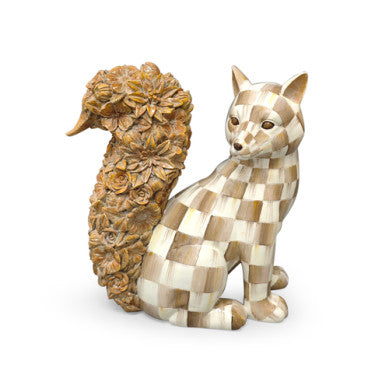 A sitting fox figurine with a checkered pattern in cream and brown, and a tail decorated with floral carvings.