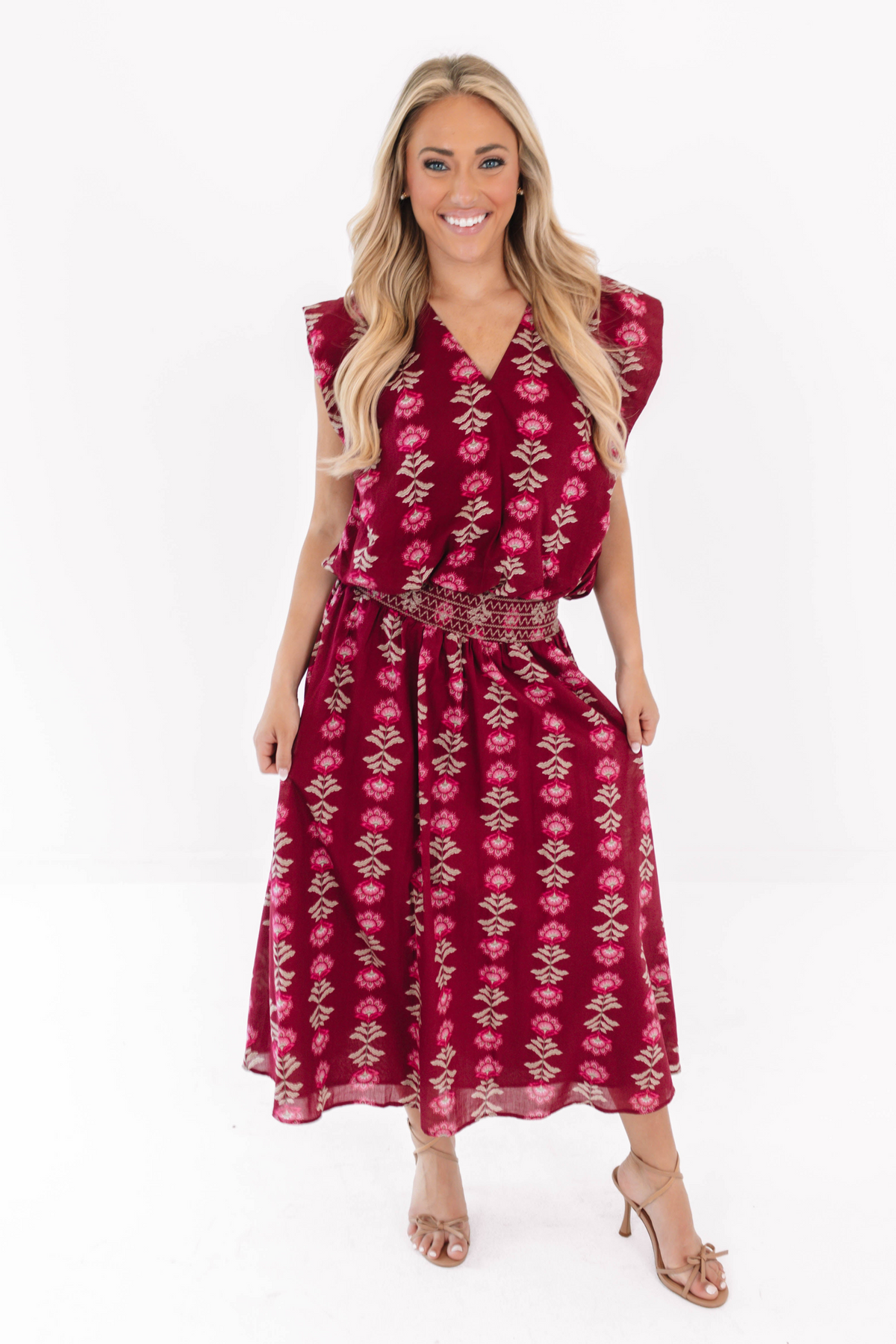 Arianne wine-colored midi skirt with floral print and an embroidered elastic waistband.