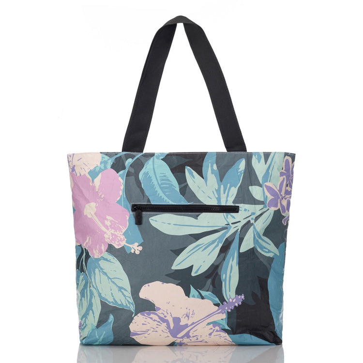 Pau Hana Day Tripper pouch in tropical print with white interior and zipper pockets.