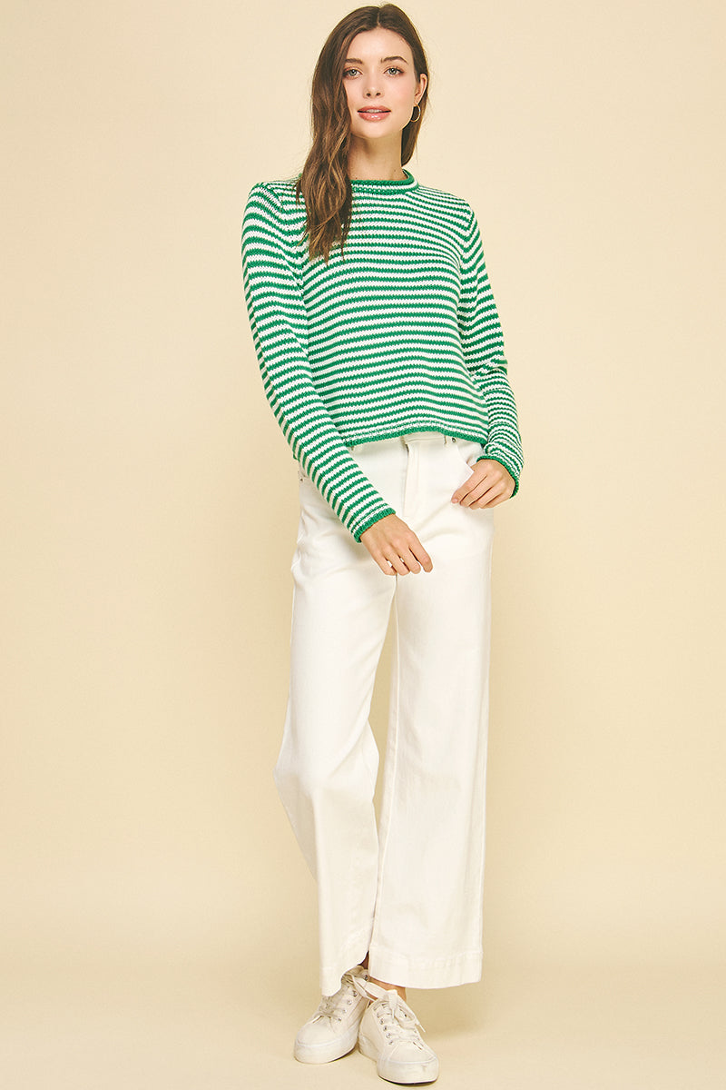 Model wearing a small Camille striped crew neck sweater in cotton acrylic blend with long sleeves.