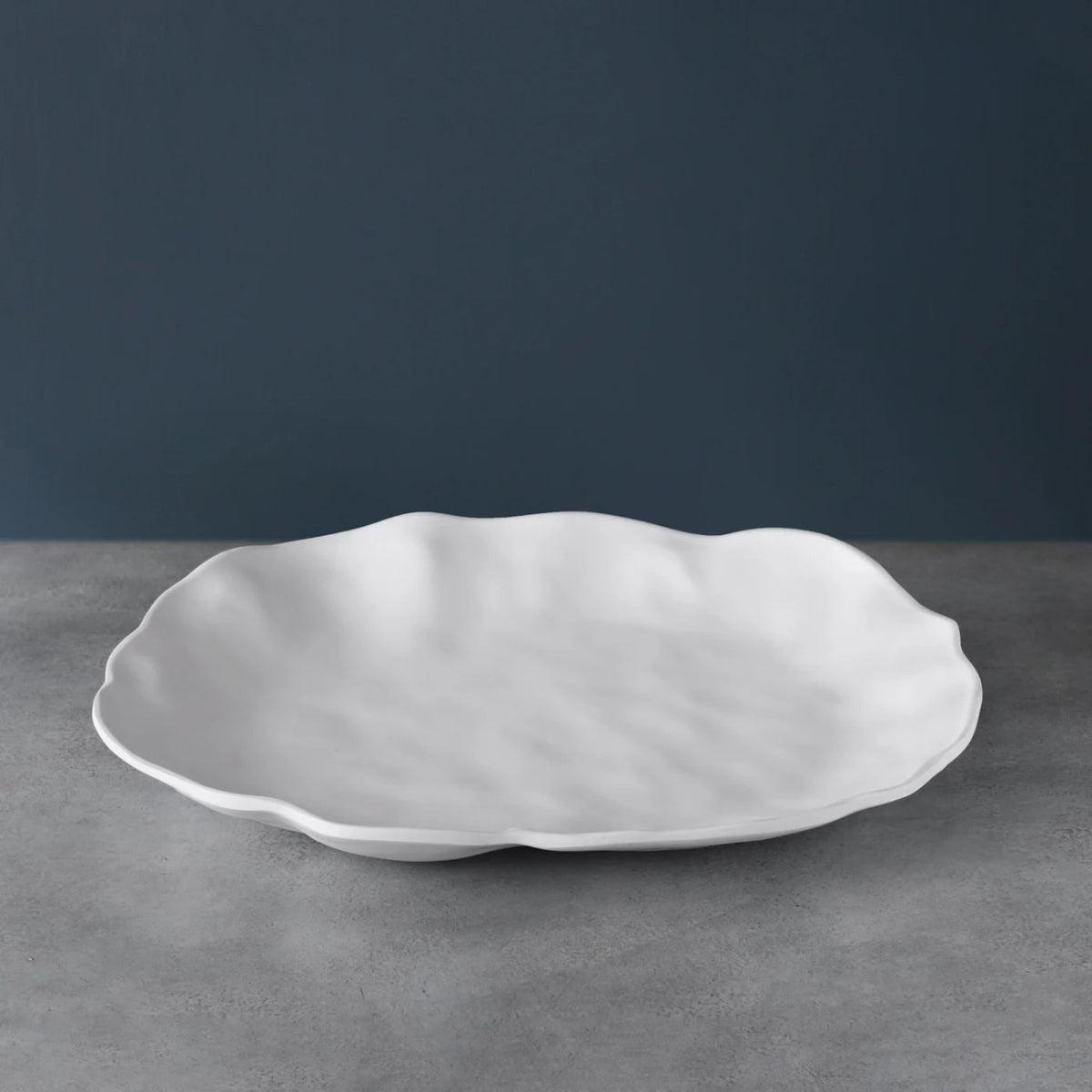 White matte melamine oval platter with heavy-weight break-resistant finish.