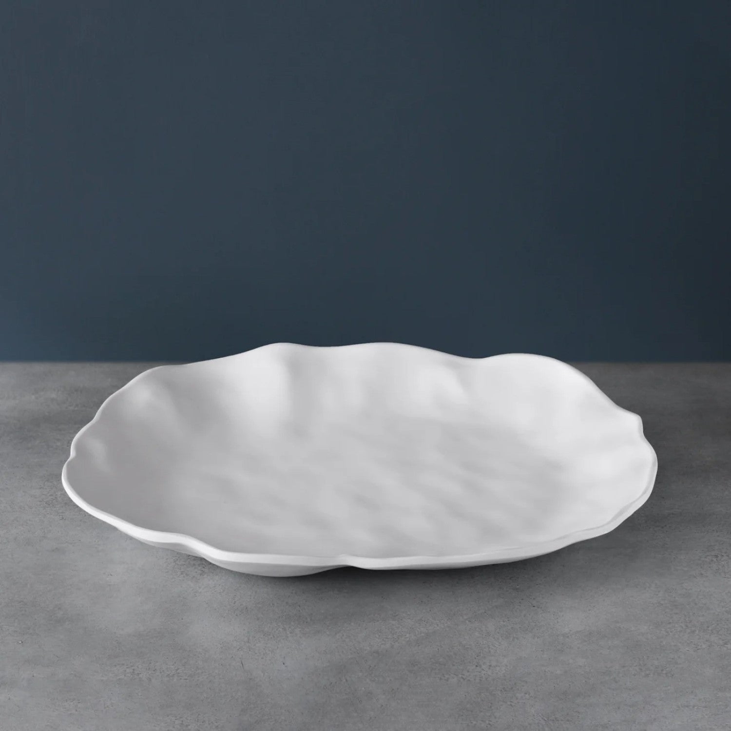 White matte melamine oval platter with heavy-weight break-resistant finish.