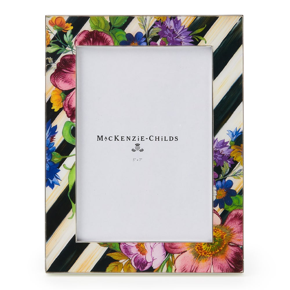 Silver-plated rectangular frame with a floral market print on the front.