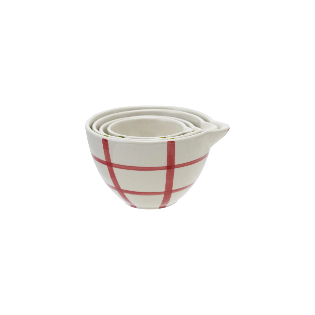 Set of four nested stoneware prep bowls with a red grid pattern and pour spouts.