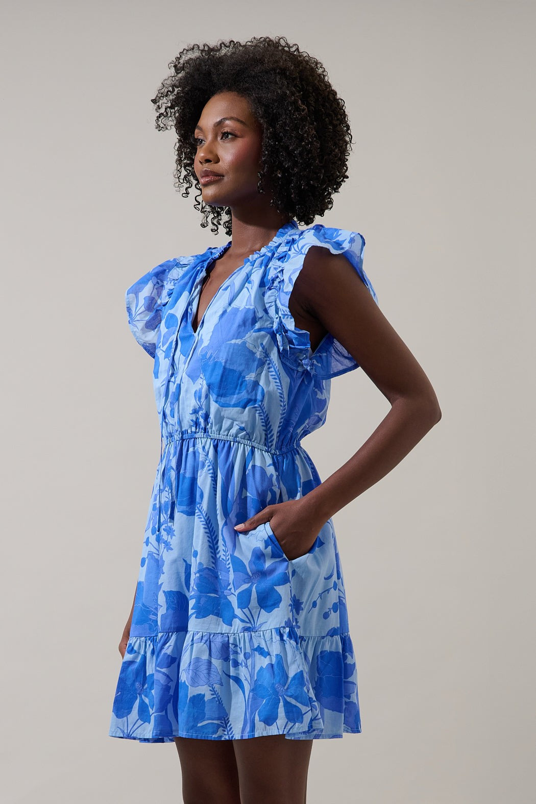 Veran Floral Sardy mini dress in cotton with floral print, shift silhouette featuring side pockets and rayon lining.