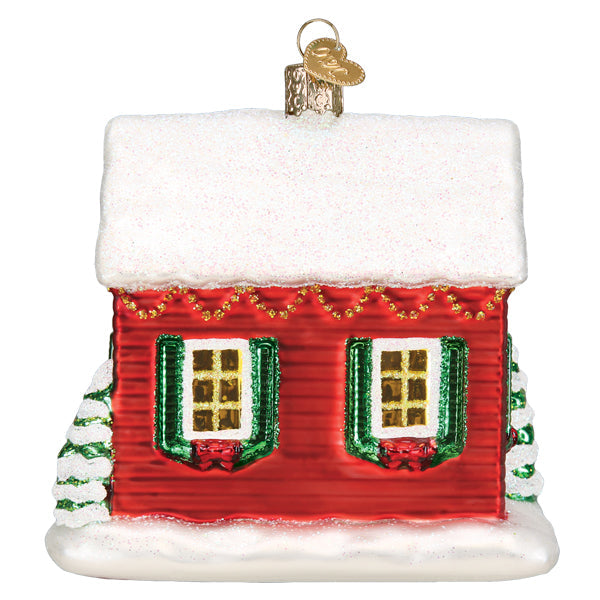 Norman Rockwell You're Home! red house ornament with snow-covered roof and green shutters.
