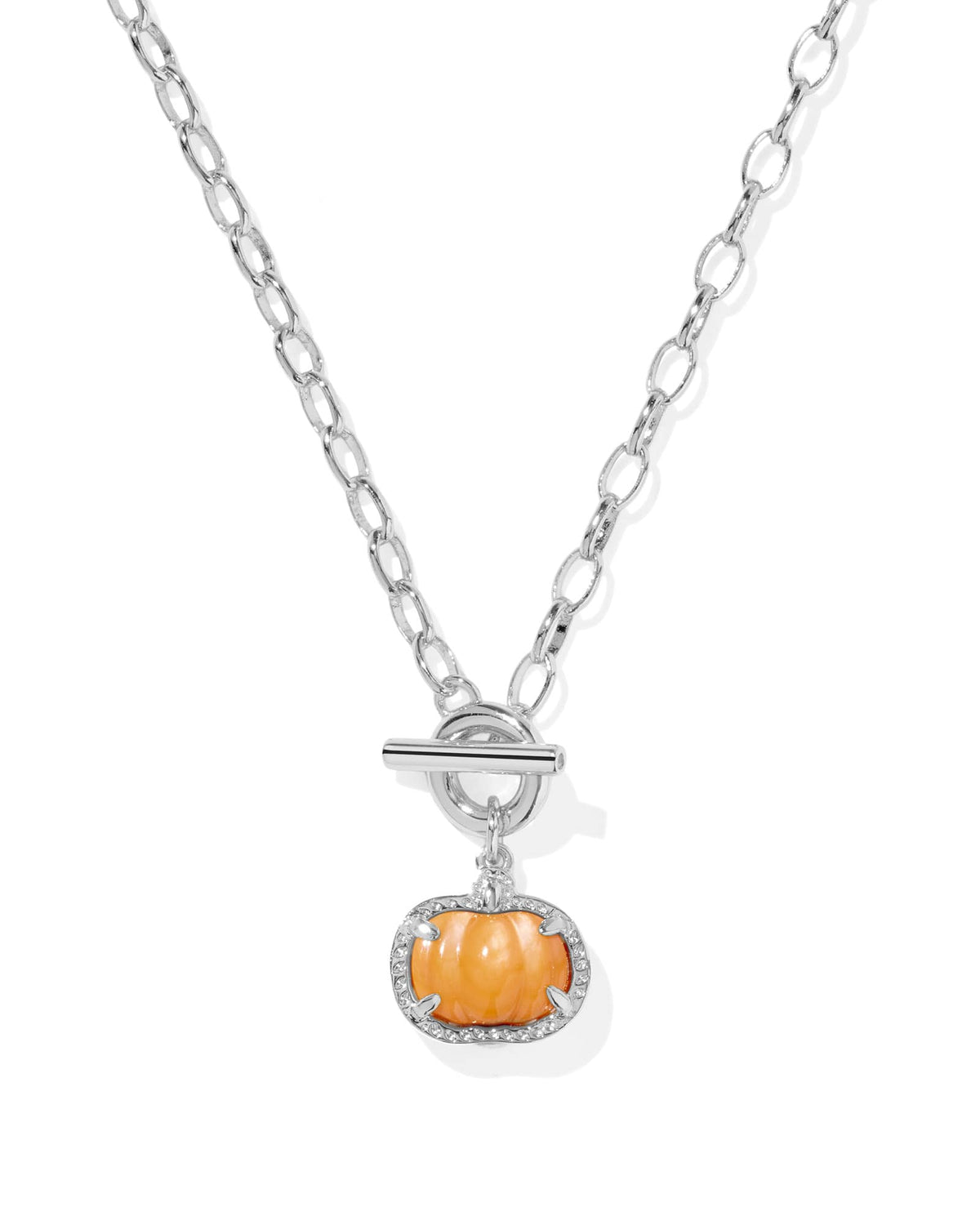 Silver chain necklace with a toggle closure and an orange mother-of-pearl pumpkin pendant.