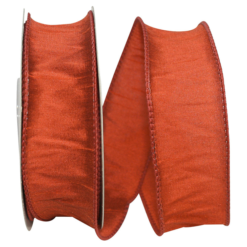 Rust-colored 1.5-inch wide Dupioni ribbon with a wired edge on a spool.