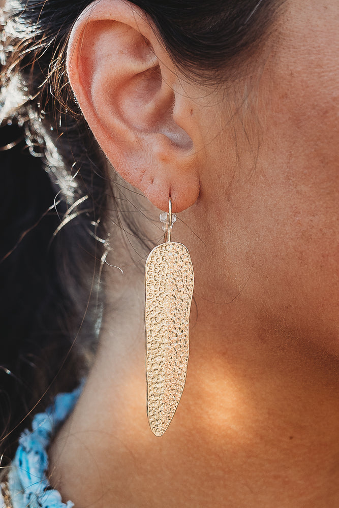 Steffany Hammered Leaf earrings in silver with a textured leaf pattern.