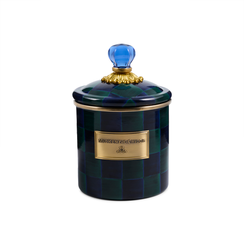 Small ceramic canister with a blue and green checkered pattern and a blue glass knob on the lid.