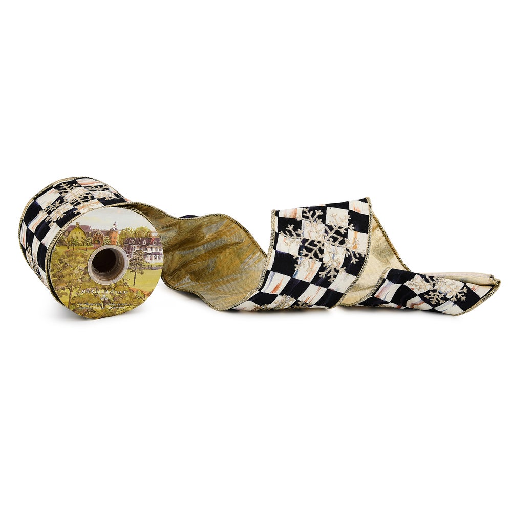 Courtly Check 4-inch wide ribbon with embroidered snowflakes and gold wired edges on a spool.