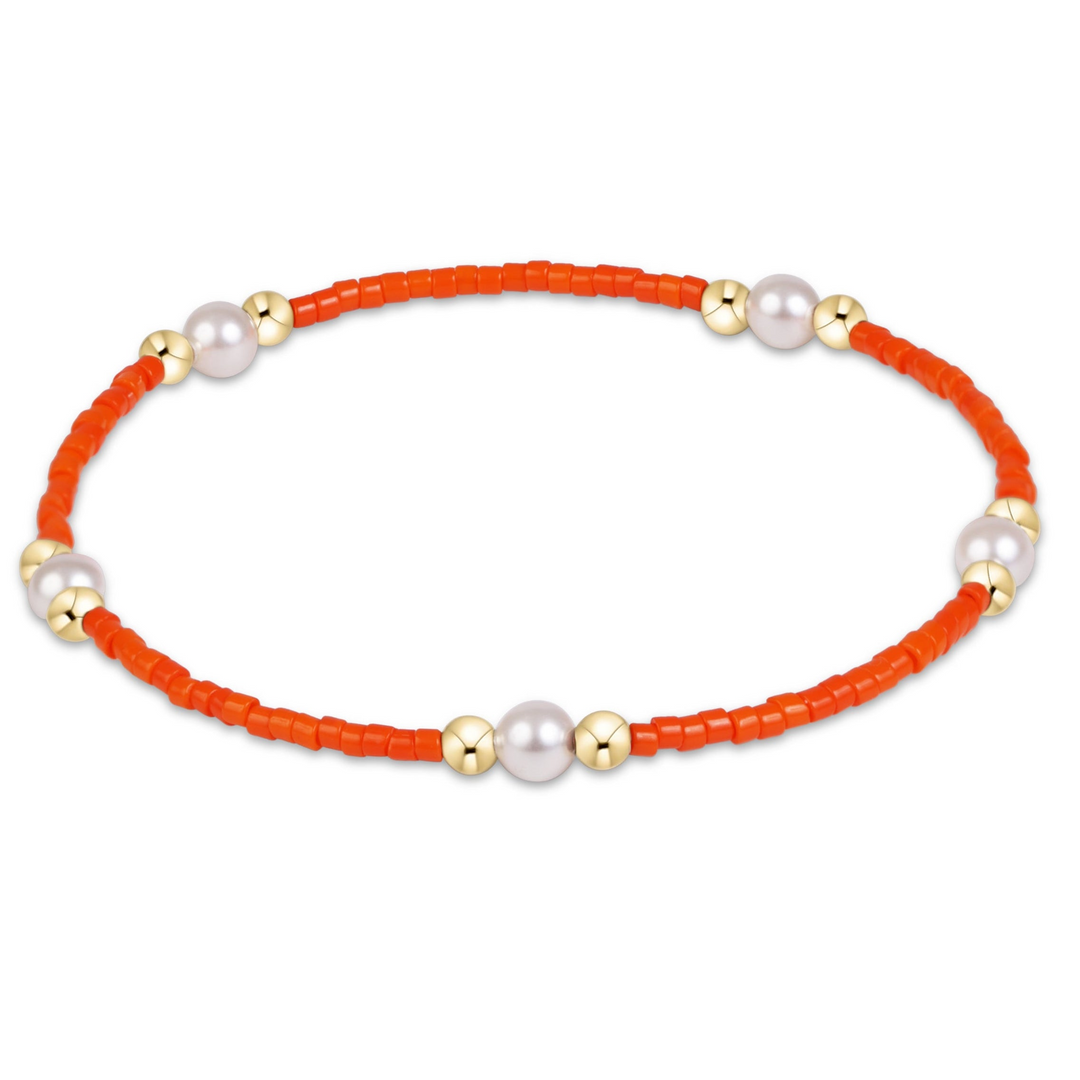 Gameday Hope Purpose Pearl Bracelet with orange seed beads, gold-filled beads, and white pearls.