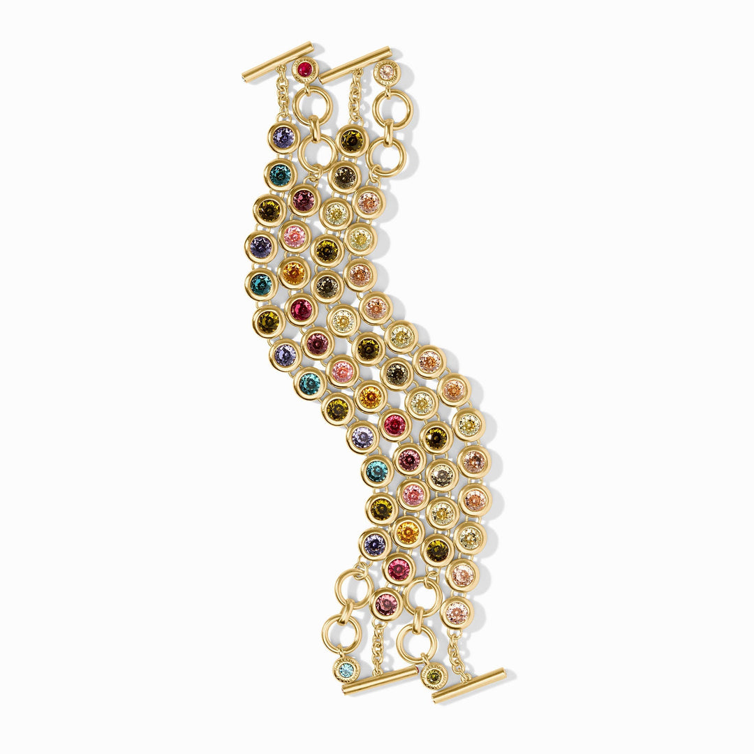 Multi-strand 24K gold plated rainbow tennis bracelet with colorful glass stones and toggle closure.