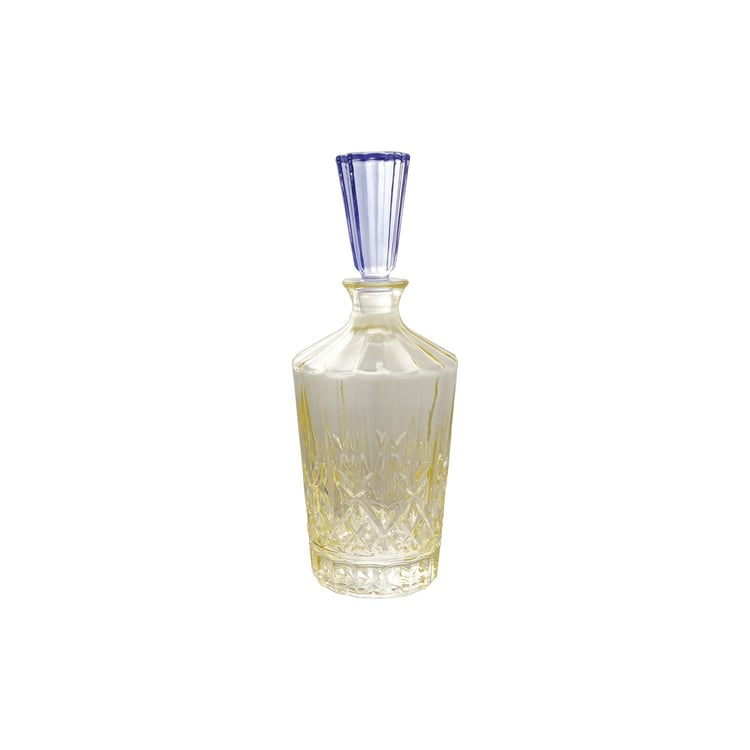 1 quart cut glass decanter with a yellow-tinted base and a blue fluted glass stopper.