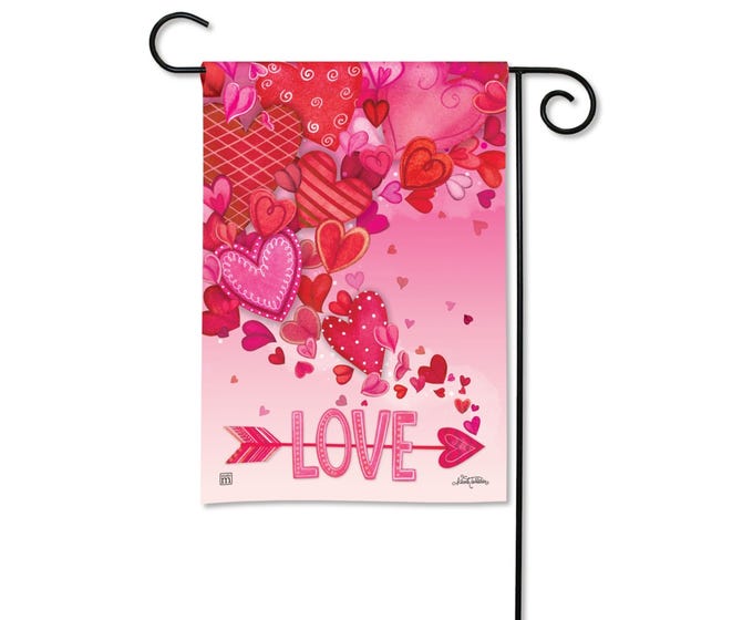 Pink garden flag with scattered hearts and the word 'LOVE' with an arrow.
