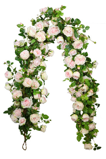 Massive mixed rose garland featuring a variety of pink roses arranged in an organic circular shape.