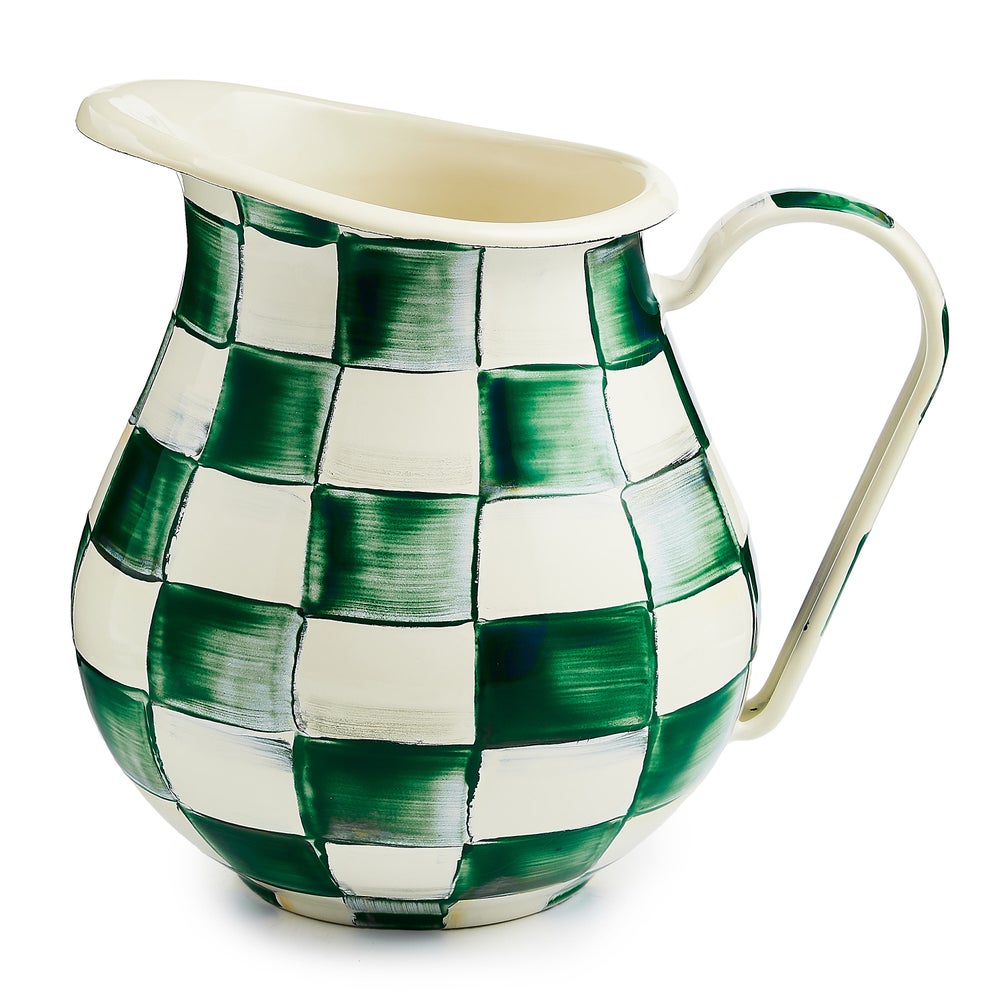Hand-glazed steel pitcher with emerald checkered pattern on heavy-gauge body.