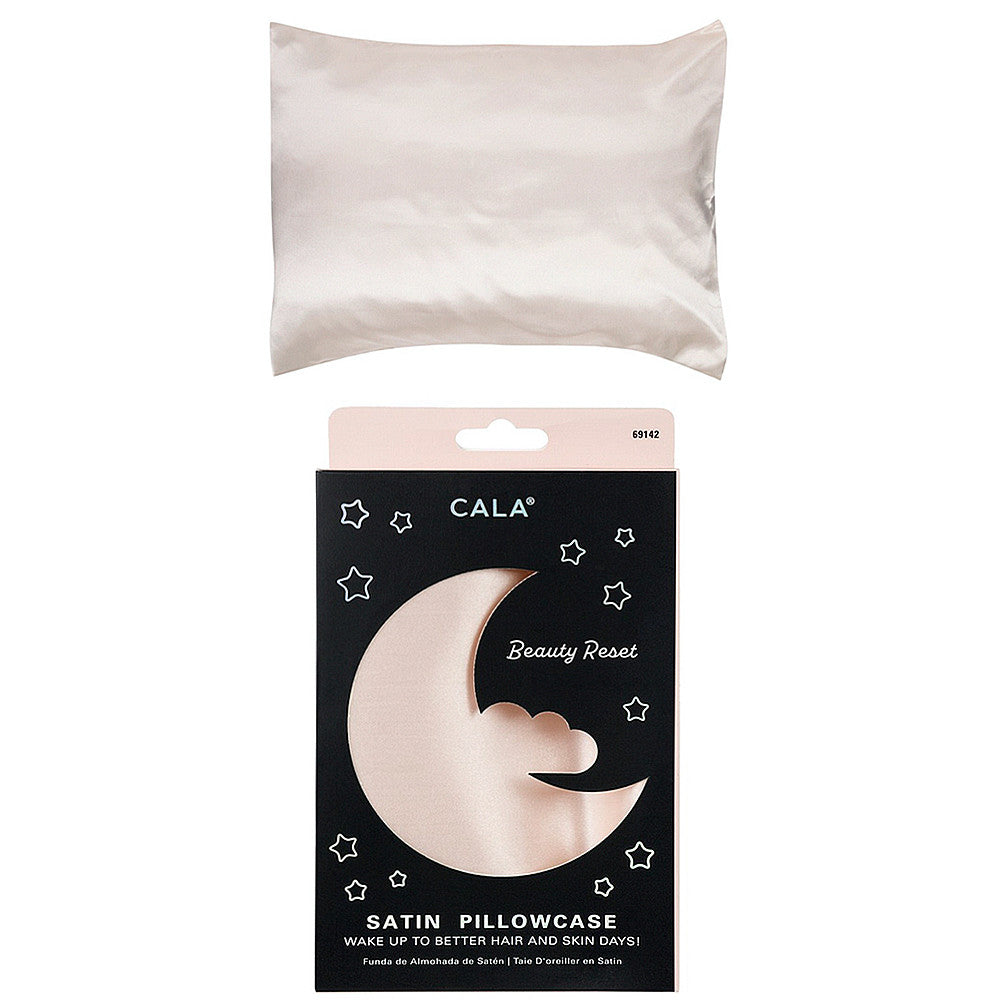Cala Satin Pillowcase in Ivory shown out of the box and in its black and pink moon-themed packaging.