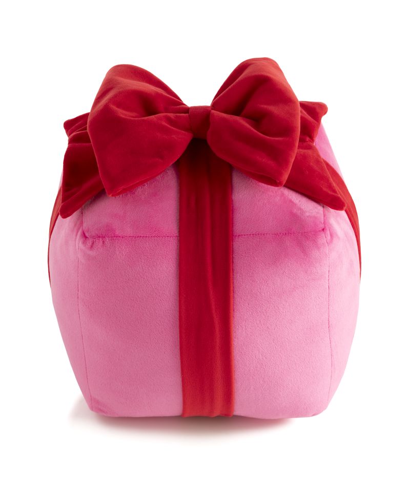 Medium pink plush gift box pillow with a large red velvet bow and ribbon.