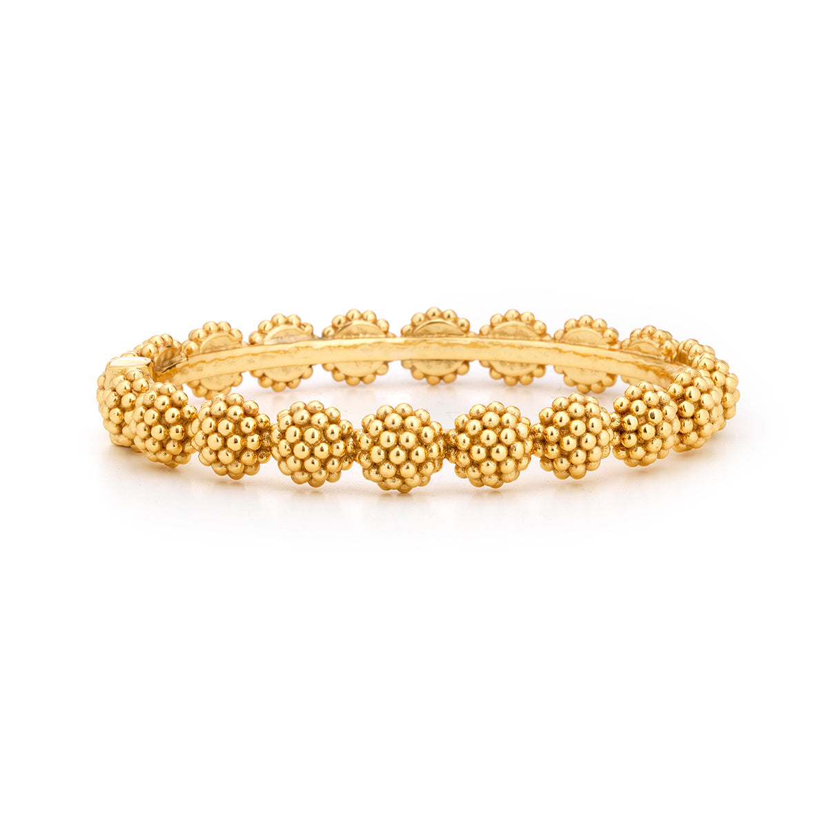 Gold hinged bangle bracelet with a berry-colored stone accent.