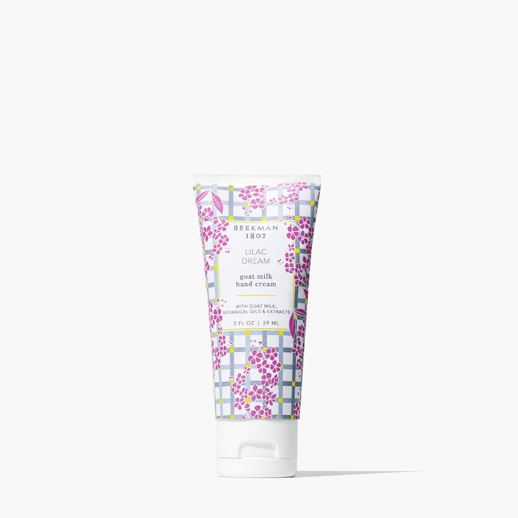 Beekman 1802 Lilac Dream goat milk hand cream in a 2 oz tube with a purple floral plaid pattern.