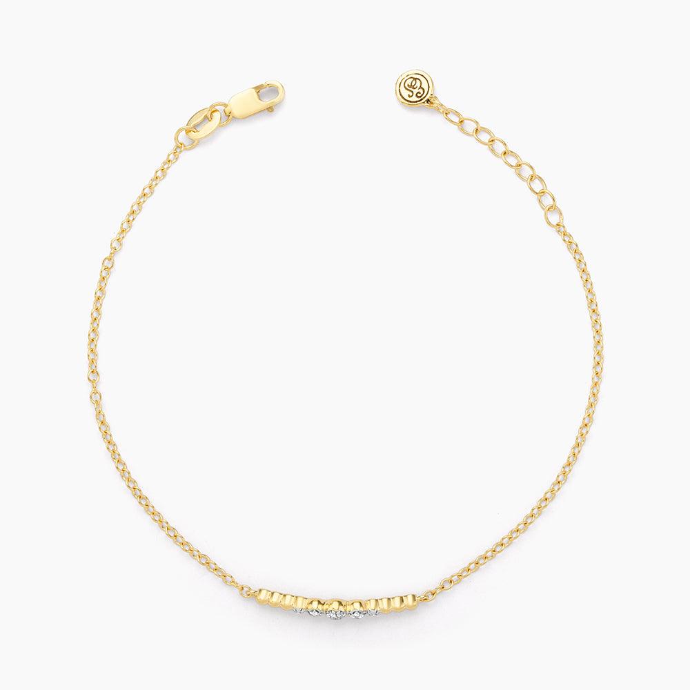 Beaded Connection Chain Bracelet in gold with a diamond-accented bead center and lobster closure.