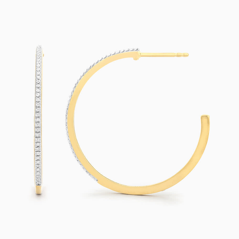 Gold medium hoop earrings with a classic circular silhouette.