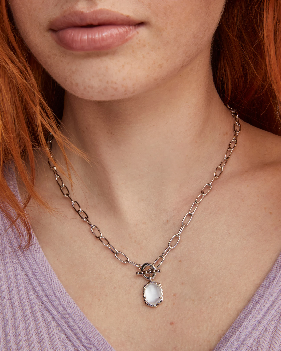 Daphne Link and Chain Necklace with a white oval pendant on a silver paperclip chain with toggle.