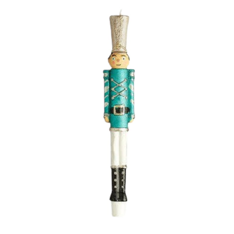 A 10-inch nutcracker soldier taper candle with a teal uniform, white pants, and a tall silver hat.