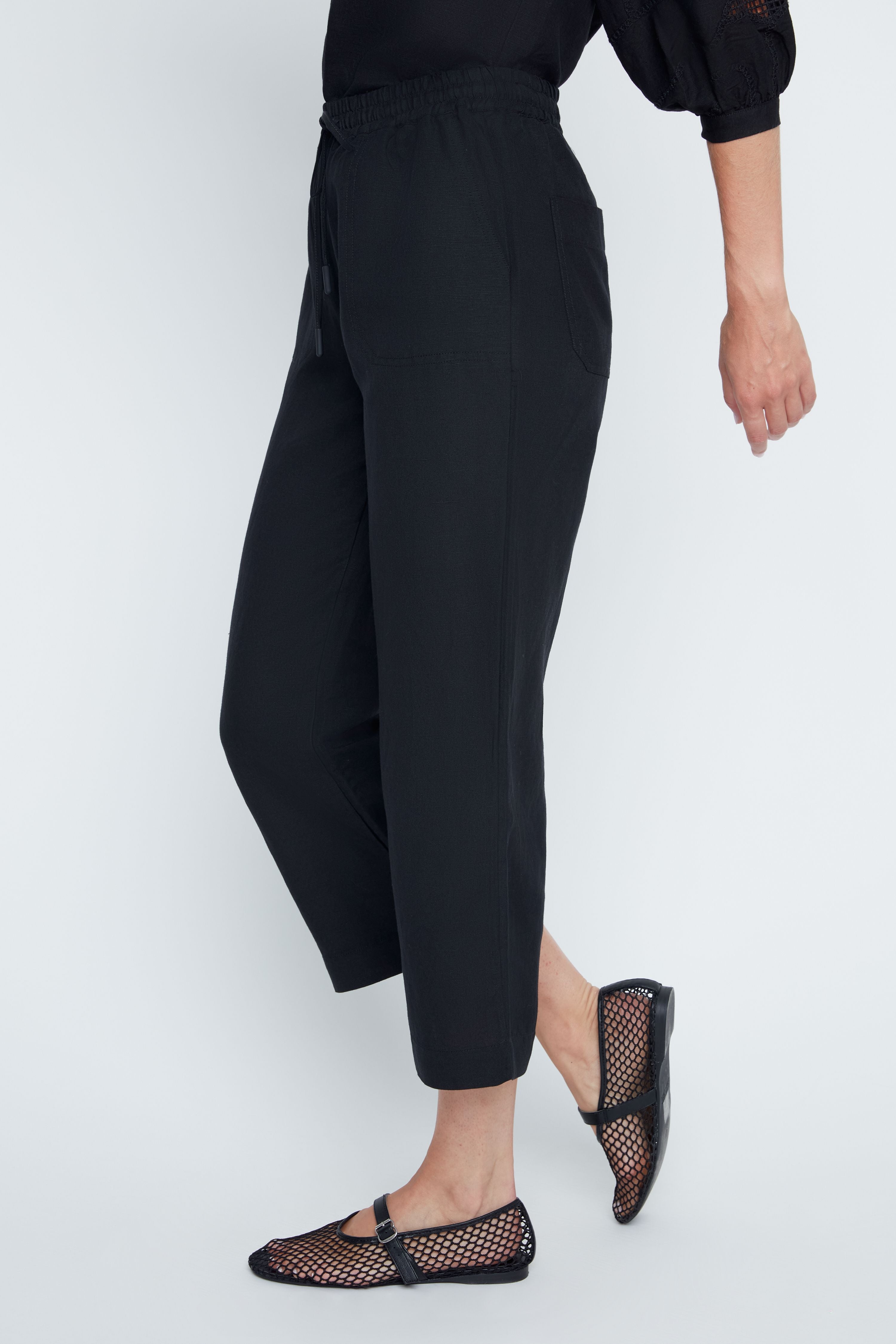 Relaxed Victoria woven pants in neutral tone with elastic waistband drawstring side pockets and cropped length.