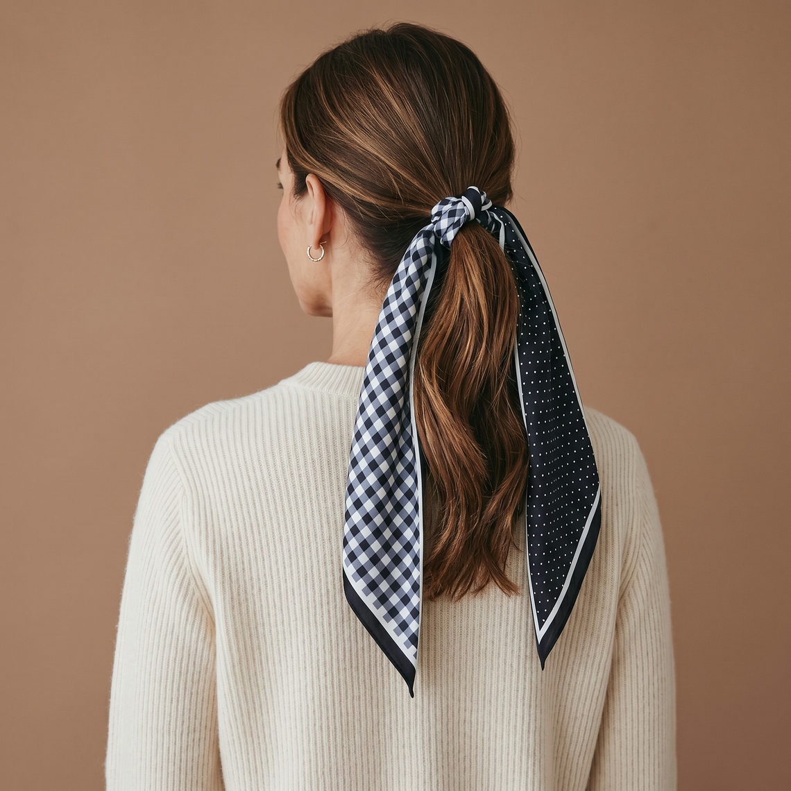 Twirl & Tie Scarf Accessory in a ponytail, featuring navy gingham and polka dot patterns.