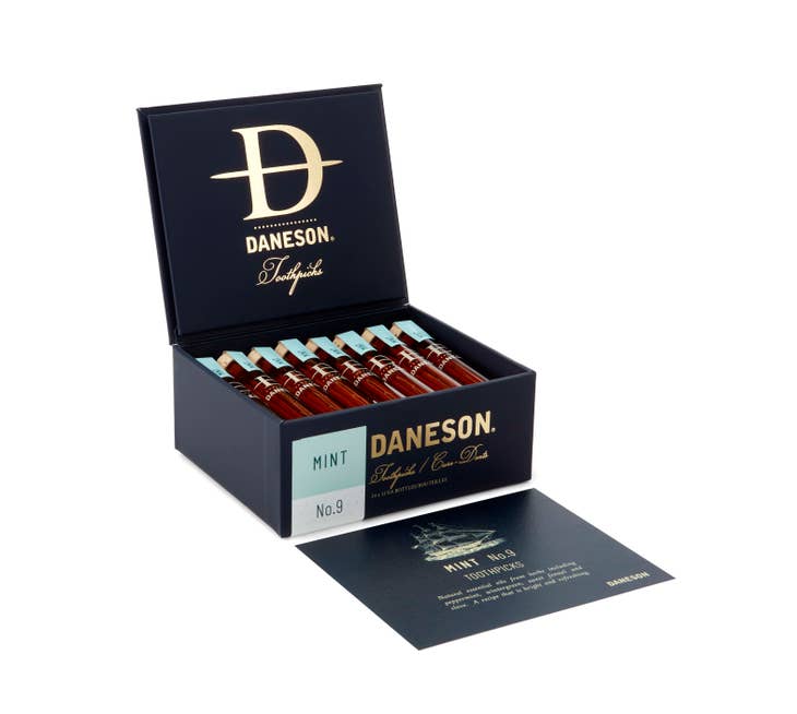 Daneson Mint No. 9 toothpicks in glass vials inside a dark blue box with a gold logo.