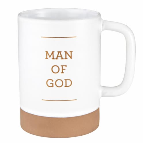 White ceramic mug with a tan base, featuring the words "MAN OF GOD" in gold lettering.