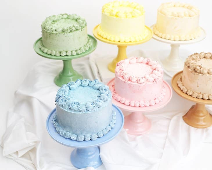 Melamine cake stand in white with a tiered circular design.