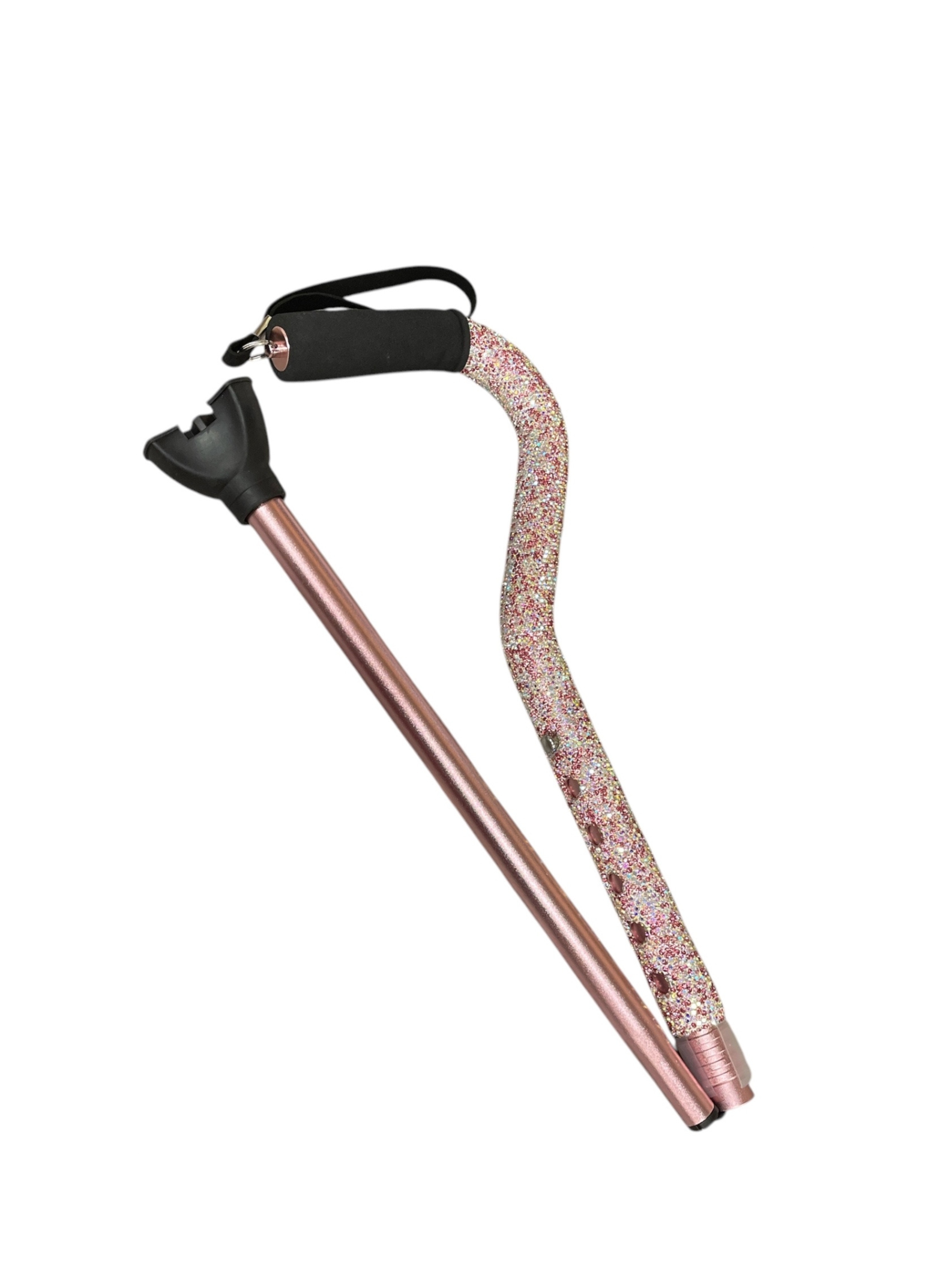 Pink rhinestone-covered folding walking cane with a black foam handle and wrist strap.