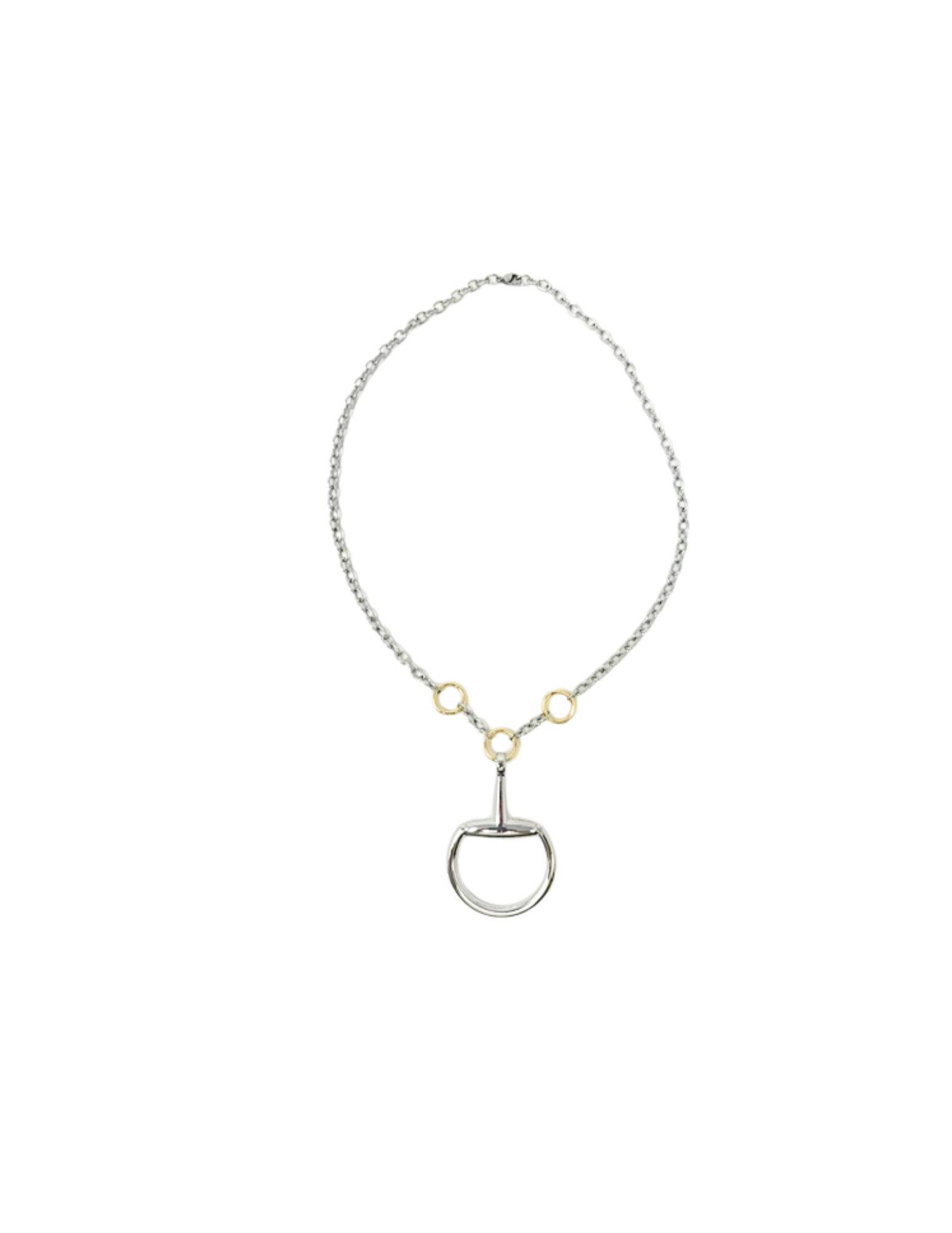 Polished silver horsebit pendant necklace with gold-tone ring accents on a delicate chain.