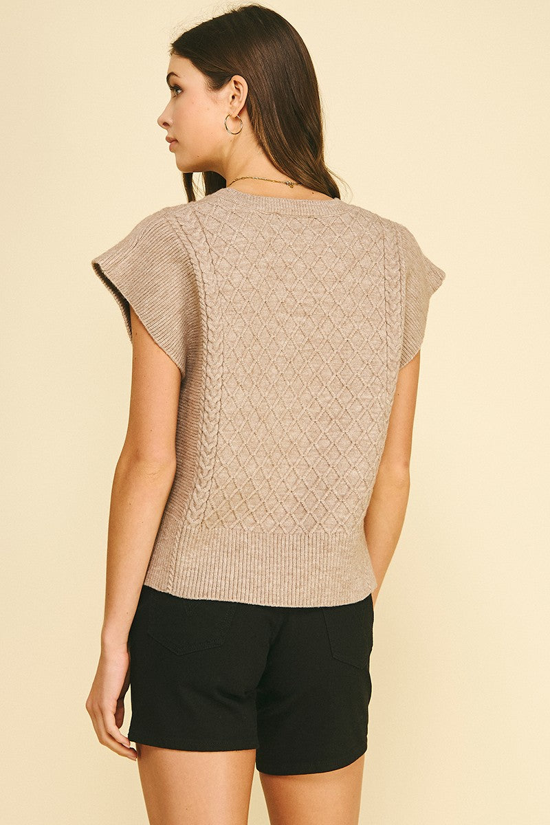 Lyndsey diamond cable knit sweater in soft gray with a relaxed fit silhouette.