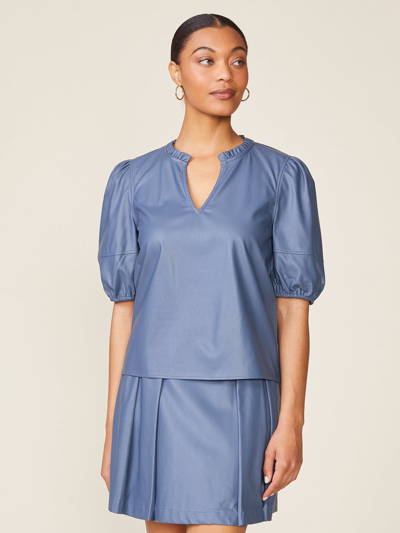 Front view of a black Kacey vegan leather blouse with viscose panels in a relaxed silhouette.