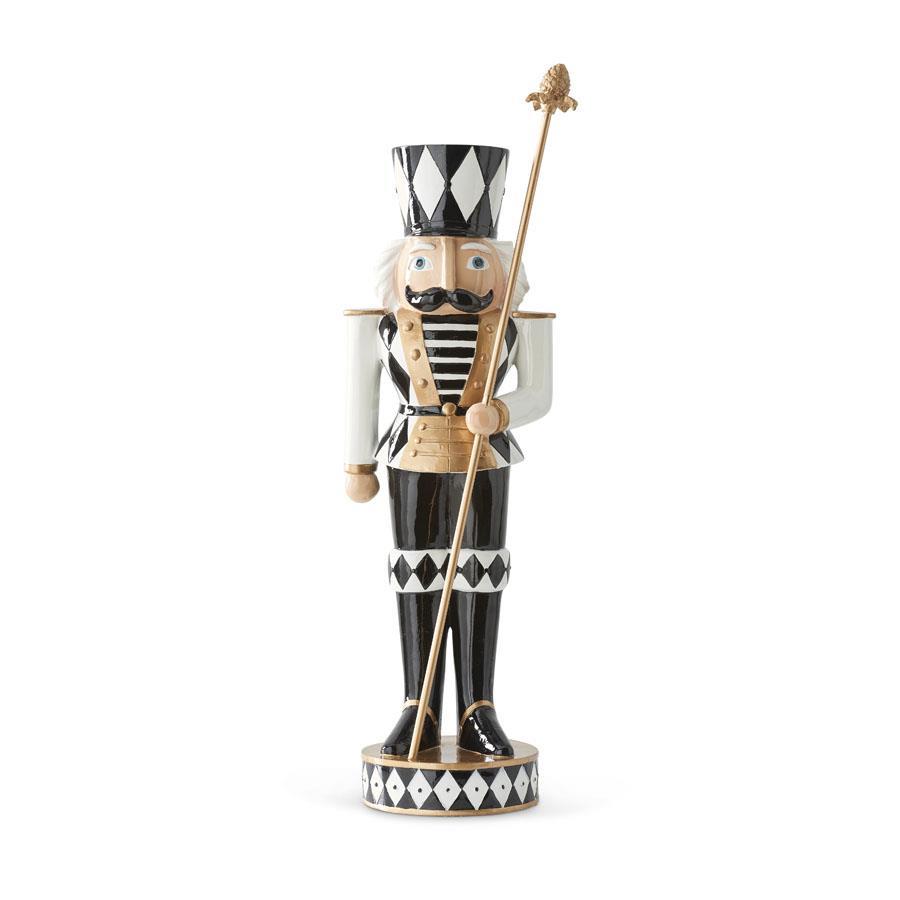 Twenty-inch black and white polyresin soldier nutcracker holding a staff