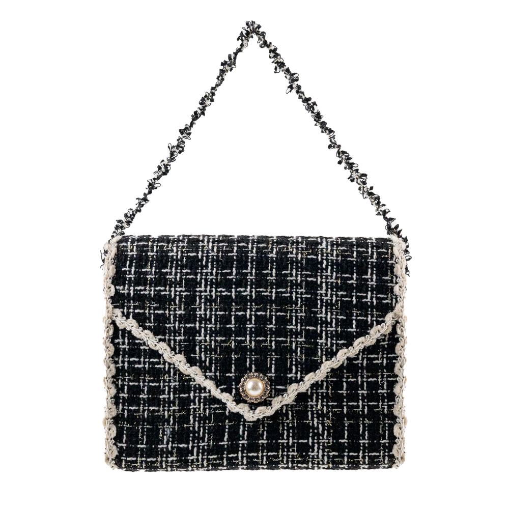 6.5-inch black and white tweed purse ornament with a pearl button and braided handle.