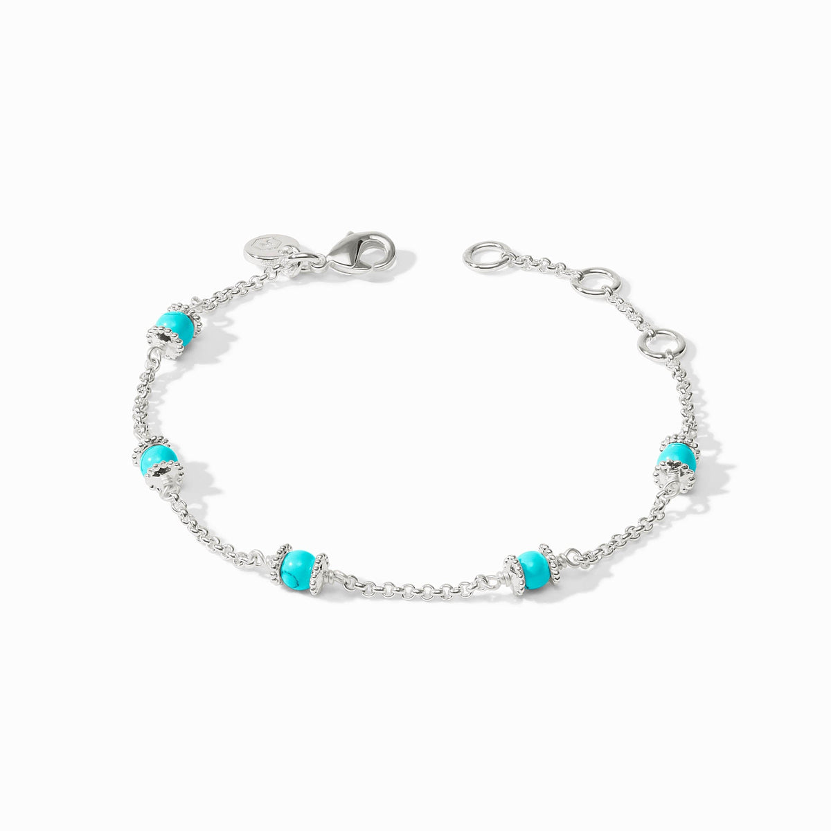 Silver adjustable bracelet with lobster clasp featuring a shell pearl center stone.