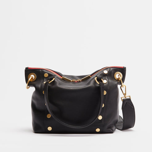 Daniel medium leather satchel bag in tan with brushed gold hardware, double-zippered pocket, and adjustable crossbody strap.