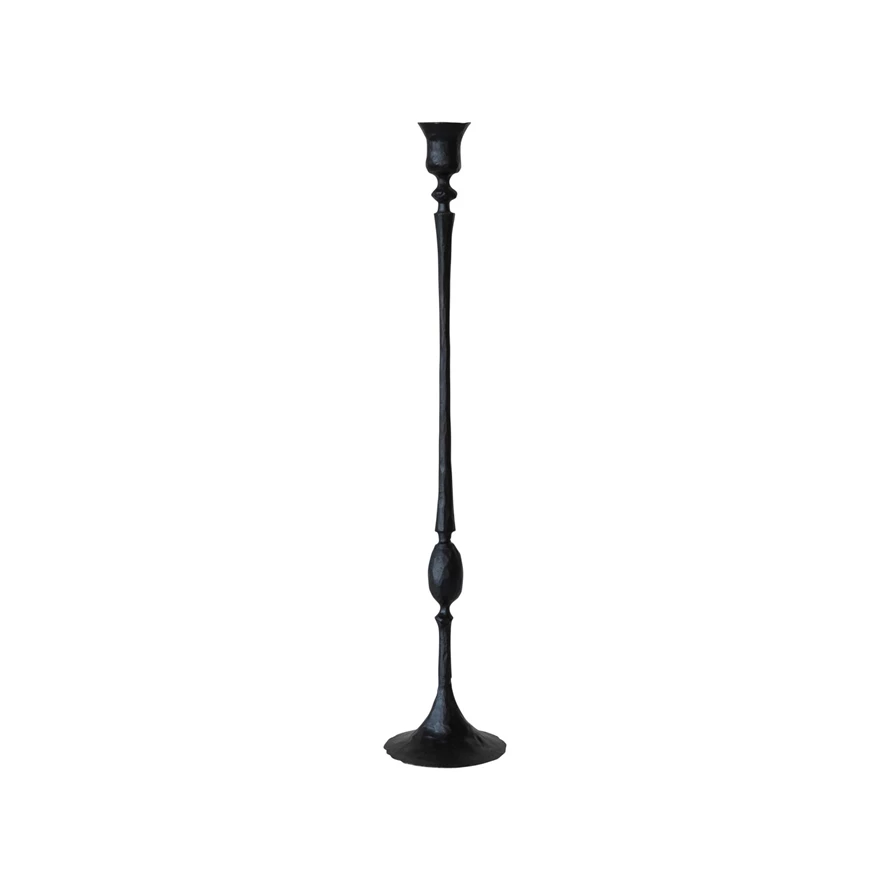 Hand-forged black cast iron taper candle holder with a textured finish and tall, slender stem.