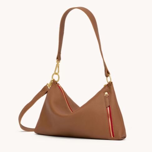 Kyle Med crossbody bag in mahogany pebbled leather with brushed gold hardware and red twill lining.